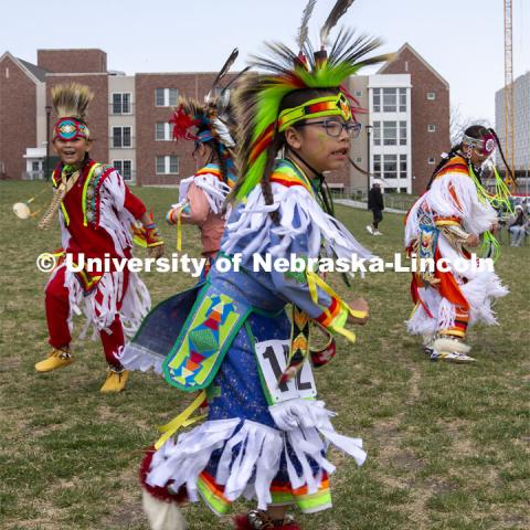 Young dancers compete for prizes during the 2022 UNITE powwow. 2022 UNITE powwow to honor graduates (K through college). Held April 23 on the greenspace along 17th Street, immediately west of the Willa Cather Dining Center. This was UNITE’s first powwow in three years. The MC was Craig Cleveland Jr. Arena director was Mike Wolfe Sr. Host Northern Drum was Standing Horse. Host Southern Drum was Omaha White Tail. Head Woman Dancer was Kaira Wolfe. Head Man Dancer was Scott Aldrich. Special contest was a Potato Dance. April 23, 2023. Photo by Troy Fedderson / University Communication.